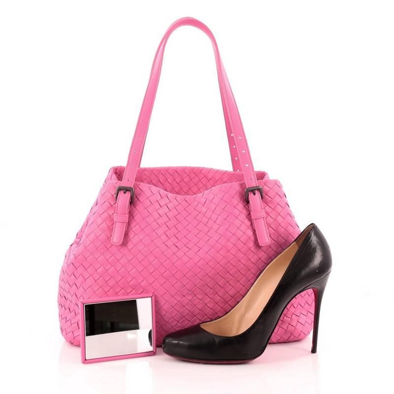 This authentic Bottega Veneta A-Shape Tote Intrecciato Nappa Medium is a statement piece you can surely take from day to night. Crafted in bright pink leather woven in Bottega Veneta's signature intrecciato method, this stylish tote features