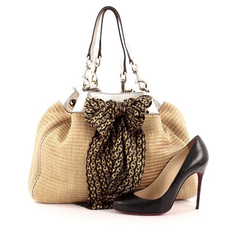 This authentic Gucci Positano Tote Raffia with Leather Large is a striking, fashionable tote for on-the-go moments. Crafted from brown raffia straw, this chic tote features metallic leather trims, printed silk scarf interlaced at the top, dual flat