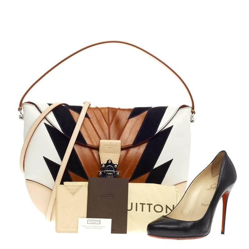 This authentic Louis Vuitton Moon Besace Leather and Eel Skin GM first presented in the brand's Spring/Summer 2015 designed by Nicolas Ghesquiere is inspired by French marquetry design and woodworking. Crafted from white leather with brown genuine