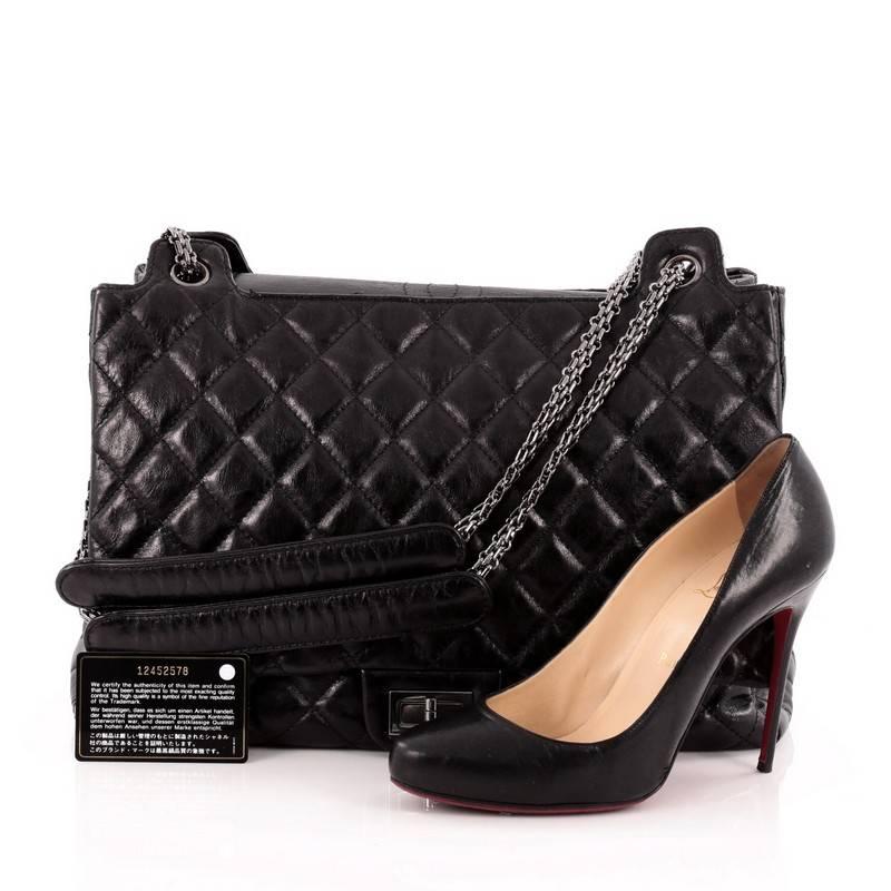 This authentic Chanel Accordion Reissue Flap Bag Quilted Calfskin XL borrows from its timeless reissue collection mixing modern luxury with classic styling. Crafted in black diamond quilted calfskin leather, this oversized tote features iconic