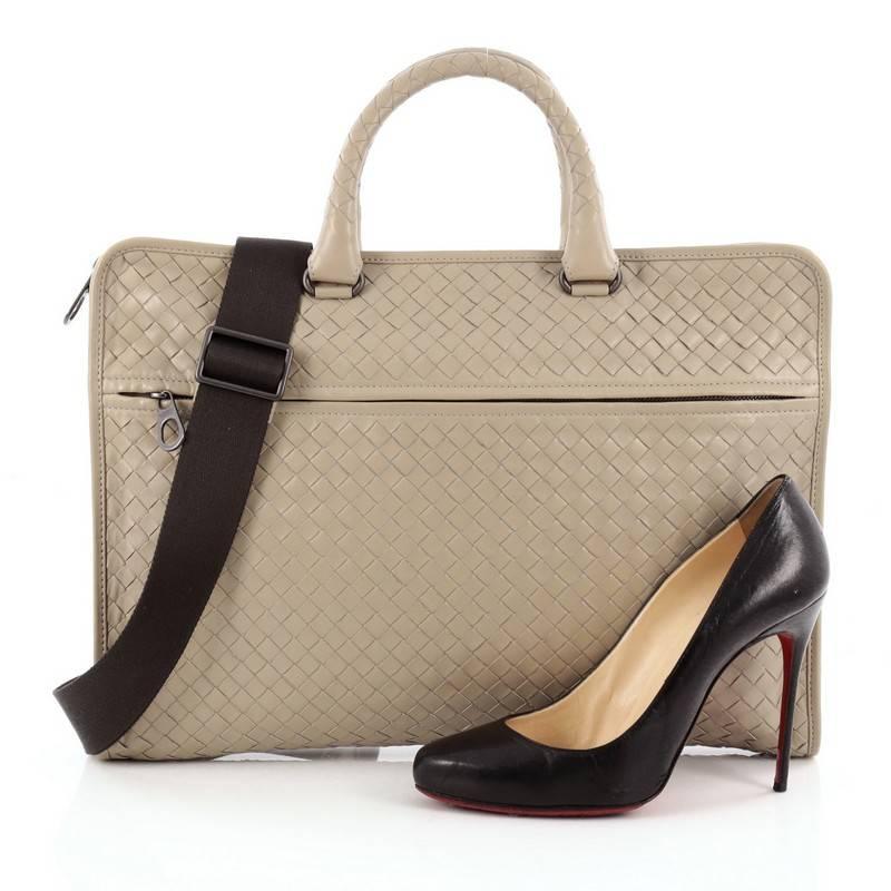 This authentic Bottega Veneta Soft Slim Briefcase Intrecciato Nappa makes a bold statement for a modern executive. Crafted in taupe in Bottega Veneta's signature intrecciato method, this functional bag features dual-rolled leather handles, front zip