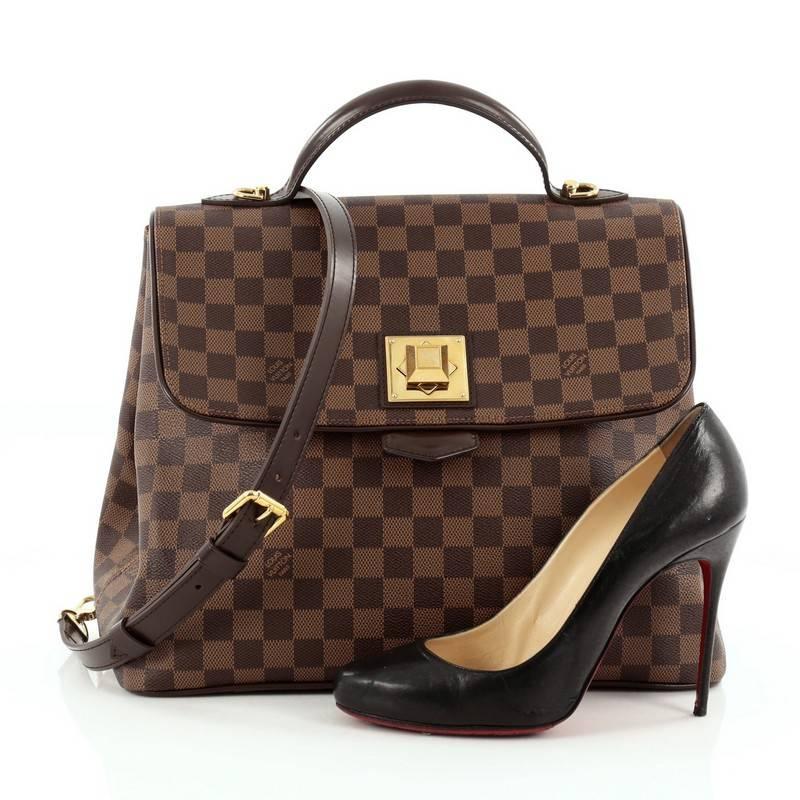 This authentic Louis Vuitton Bergamo Handbag Damier GM is a contemporary chic bag that shows a special touch of luxury and style. Crafted from damier ebene canvas, this elegant, vintage-inspired bag features a flat leather top handle, removable