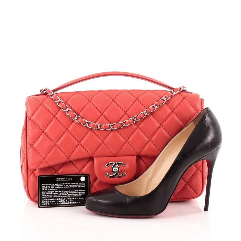 This authentic Chanel Easy Carry Flap Bag Quilted Lambskin Jumbo presented in the brand's 2015 Collection is a casual, elegant flap bag made for everyday use. Crafted in red diamond quilted lambskin leather, this bag features a wide single leather