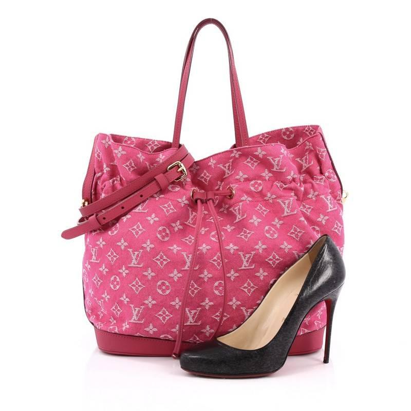 This authentic Louis Vuitton Noefull Handbag Denim MM presented in the brand's Spring/ Summer 2013 Collection combines the Noe and Neverfull making this chic and fresh bag a necessity for Louis Vuitton lovers. Crafted in pink monogram denim with