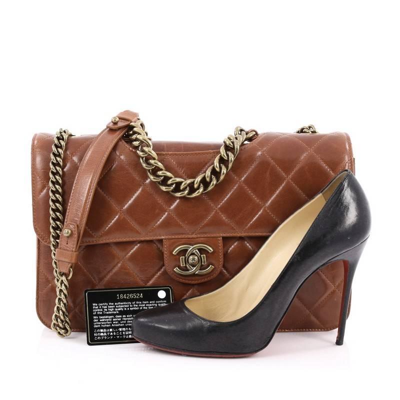 This authentic Chanel Perfect Edge Flap Bag Quilted Glazed Calfskin Medium released in Chanel's Fall 2012-2013 Collection is an eye-catching modern update to the classic flap. Crafted in dark brown brown quilted glazed calfskin leather, this