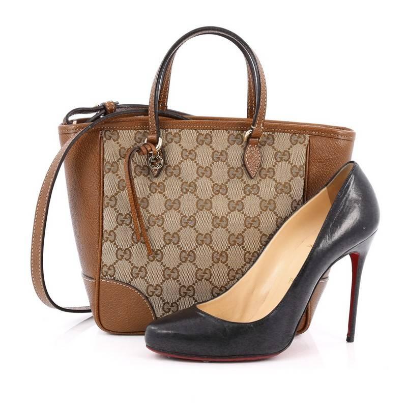 This authentic Gucci Bree Top Handle Bag GG Canvas with Leather Small is made for any casual or sophisticated outfit. Crafted in light brown GG canvas with brown leather trims, this petite tote features dual flat handles, small interlocking Gucci