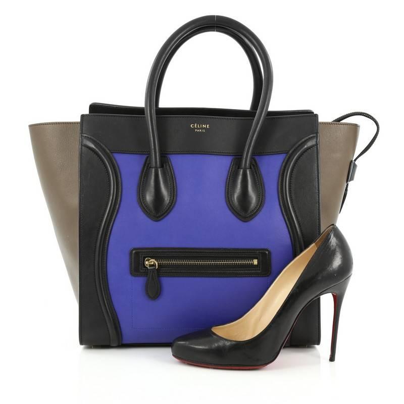 This authentic Celine Tricolor Luggage Handbag Leather Mini is one of the most sought-after bags beloved by fashionistas. Crafted from tricolor indigo blue, black leather with taupe leather wings, this minimalist tote features dual-rolled handles,