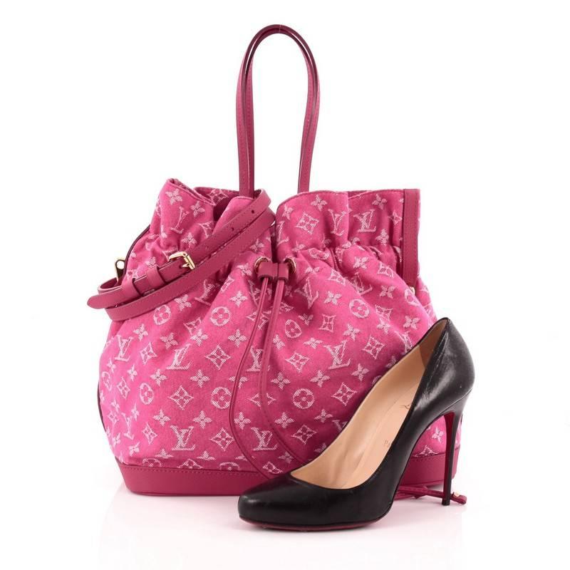 This authentic Louis Vuitton Noefull Handbag Denim MM presented in the brand's Spring/ Summer 2013 Collection combines the Noe and Neverfull making this chic and fresh bag a necessity for Louis Vuitton lovers. Crafted in pink monogram denim with
