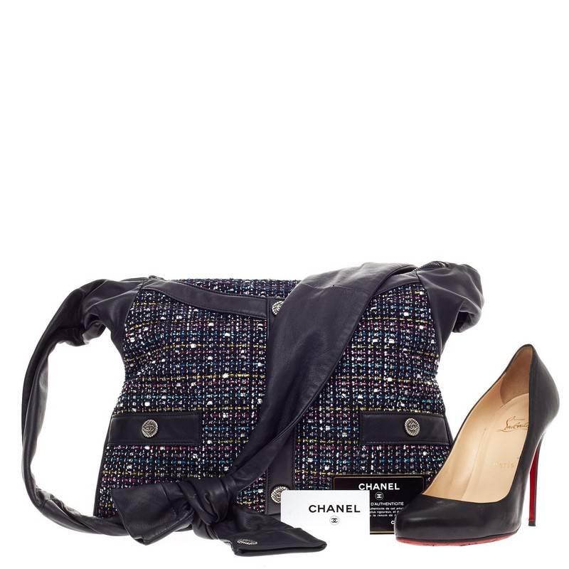 This authentic Chanel Girl Bag Tweed and Leather Small inspired by Chanel’s iconic tweed jacket was first presented during the brand's Spring/Summer 2015 Runway Collection. Crafted from navy blue leather with plush multi-colored tweed design, this