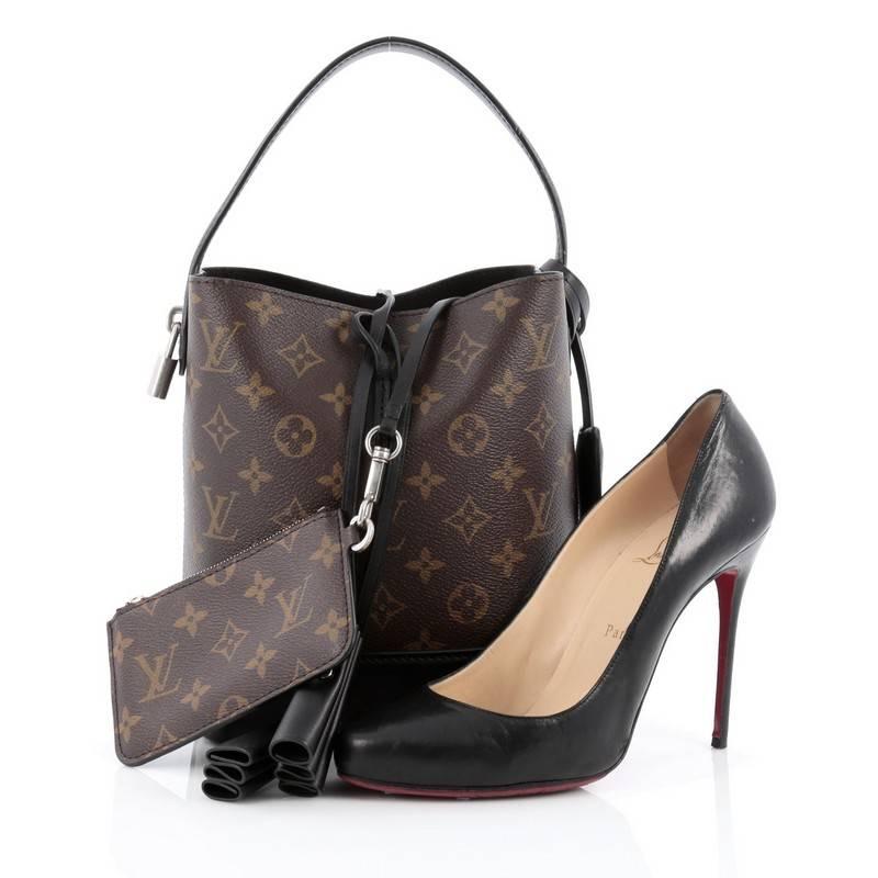 This authentic Louis Vuitton NN14 Idole Bucket Bag Monogram Canvas and Leather PM is a refreshed version of the iconic Noe, and holds a coveted place in the last Louis Vuitton collection designed by Marc Jacobs. Crafted from brown monogram coated