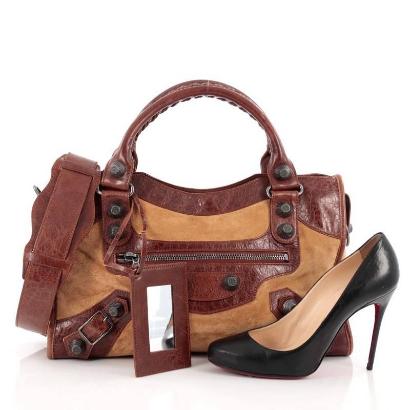 This authentic Balenciaga City Giant Studs Handbag Suede and Leather Medium is for the on-the-go fashionista. Constructed from beige suede and brown leather, this popular bag features dual braided woven handles, exterior front zip pocket, iconic
