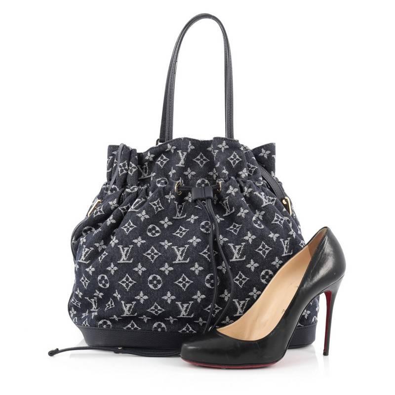 This authentic Louis Vuitton Noefull Handbag Denim MM presented in the brand's Spring/ Summer 2013 Collection combines the Noe and Neverfull making this chic and fresh bag a necessity for Louis Vuitton lovers. Crafted in blue monogram denim with