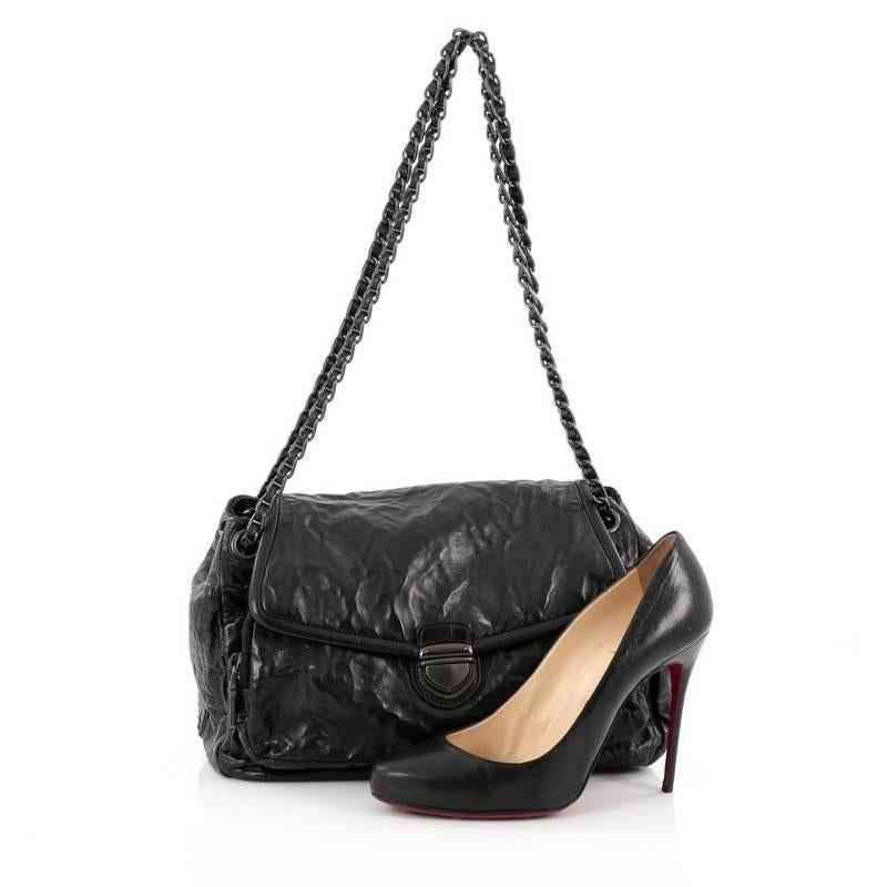 This authentic Prada Pushlock Chain Flap Shoulder Bag Nappa Antique Medium is perfect for everyday use. Crafted in nero black nappa antique leather, this bag features woven-in leather chain straps, exterior back slip pocket, frontal flap with