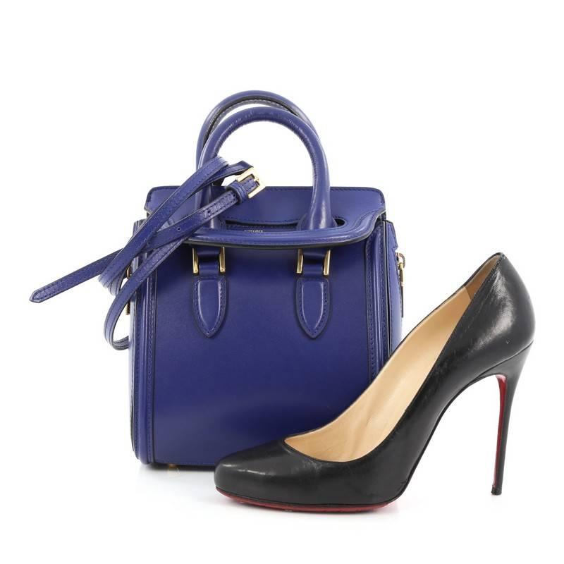 This authentic Alexander McQueen Heroine Tote Leather Mini combines functional style with luxurious design. Crafted in blue leather, this miniature structured bag features dual-rolled leather handles, gusseted oversized side zipper details for a