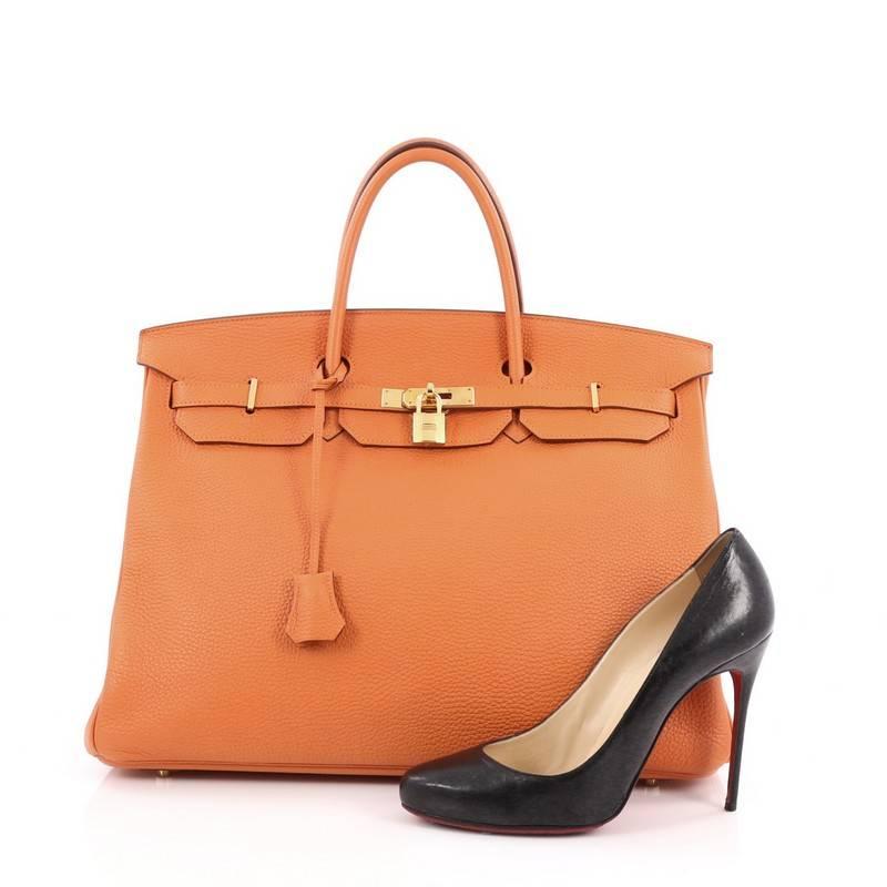 This authentic Hermes Birkin Handbag Orange Togo with Gold Hardware 40 stands as one of the most-coveted bags fit for any fashionista. Constructed from sturdy, scratch-resistant orange togo leather, this stand-out oversized tote features dual-rolled