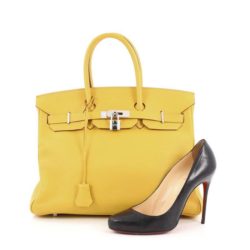 This authentic Hermes Birkin Handbag Soleil Yellow Clemence with Palladium Hardware 35 stands as one of the most-coveted and timeless bags fit for any fashionista. Uniquely constructed from scratch-resistant soleil yellow clemence leather, this