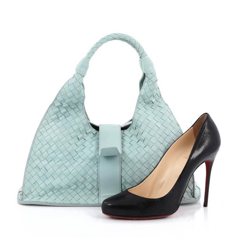 This authentic Bottega Veneta Top Flap Hobo Intrecciato Nappa Large is simple and sophisticated in design perfect for everyday use. Crafted in seafoam green nappa leather, this hobo features signature woven intrecciato method design, dual-rolled