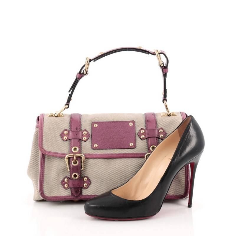 This authentic Louis Vuitton Sac Express Trianon Handbag Toile and Ostrich PM presented in Spring-Summer 2004 runway collection for Louis Vuitton's 150th anniversary is unique in design perfect for LV lovers. Inspired by Louis Vuitton's luggages,