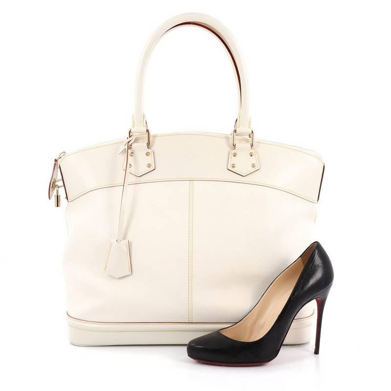 This authentic Louis Vuitton Suhali Lockit Handbag Leather GM is updated to the present borrowing from its 1958 original design with a modern twist. Crafted from off white suhali leather, this functional tote feature dual-rolled handles, off white