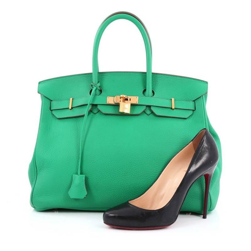 This authentic Hermes Birkin Handbag Menthe Green Clemence with Gold Hardware 35 stands as one of the most-coveted and timeless bags fit for any fashionista. Uniquely constructed from scratch-resistant menthe green clemence leather, this subtly