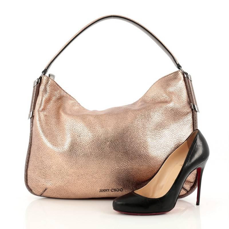 This authentic Jimmy Choo Zoe Hobo Leather with Snakeskin is a minimalist, understated hobo made for everyday use. Crafted from copper leather, this luxurious bag features a flat looped leather shoulder strap, snakeskin trims, intricate woven design