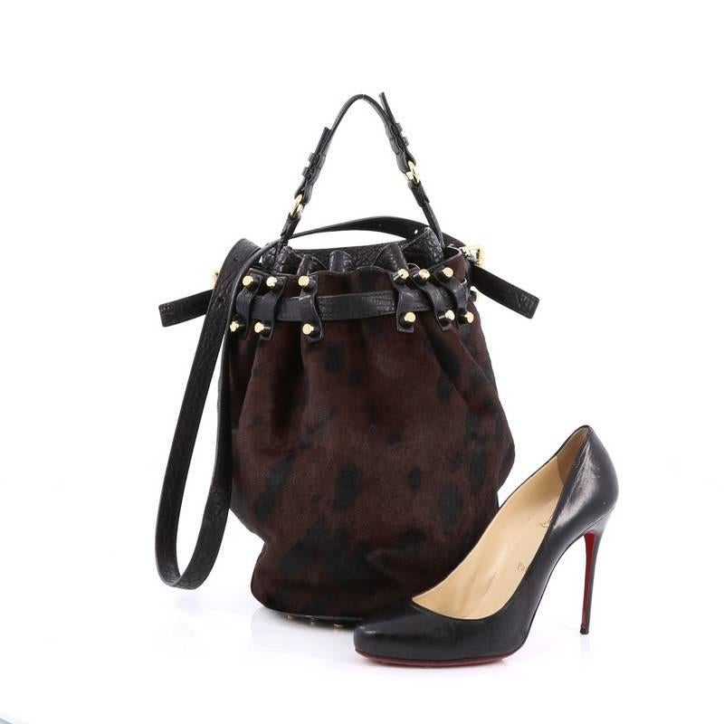 This authentic Alexander Wang Diego Bucket Bag Calf Hair Large is a highly sought-after bag with a stylishly edgy look. Crafted from genuine brown and black calf hair with black leather trims, this popular bucket bag features flat leather handle,