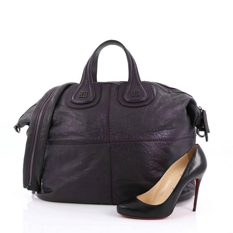 This authentic Givenchy Nightingale Satchel Leather Large is a stylish and functional carry-all fit for all needs. Constructed in metallic purple leather, this satchel is defined by its stitched quarters, embossed Givenchy logo emblem at its