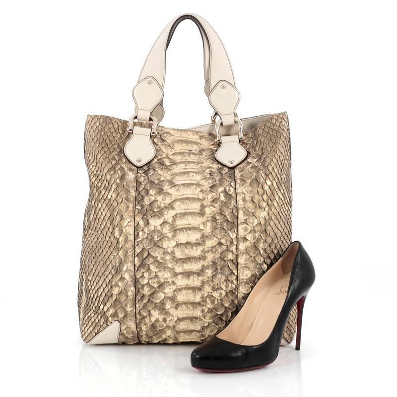 This authentic Gucci Creole Tote Python Large is a luxe tote that combines practicality and upscale fashion. Crafted from genuine light yellow and gold python, this chic bag features dual-flat top handles, cream leather trims, protective base studs