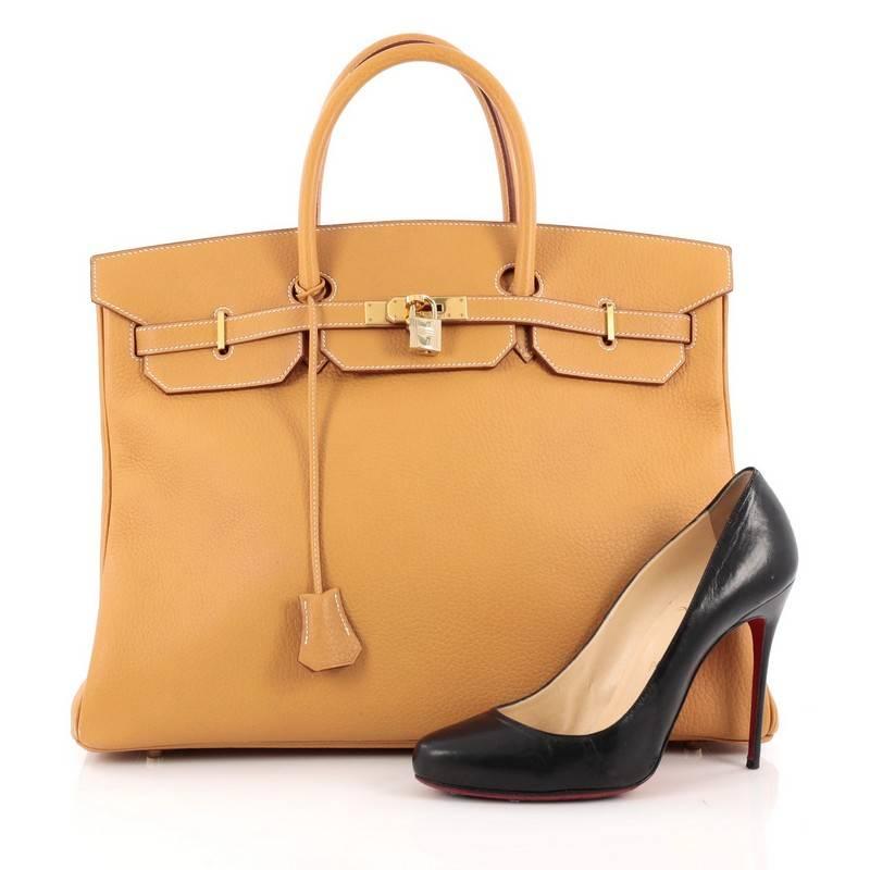 This authentic Hermes Birkin Handbag Natural Sable Brown Fjord with Gold Hardware 40 stands as one of the most-coveted bags fit for any fashionista. Constructed from sturdy, scratch-resistant natural sable brown fjord leather, this stand-out