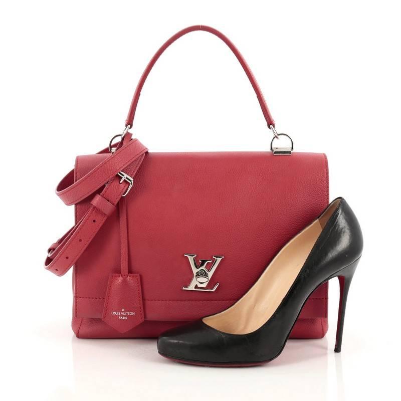 This authentic Louis Vuitton Lockme II Bag Leather presented in the brand's 2015 Collection is a must-have signature, city bag made for the modern woman. Crafted from red leather, this chic bag features an adjustable removable shoulder strap, side