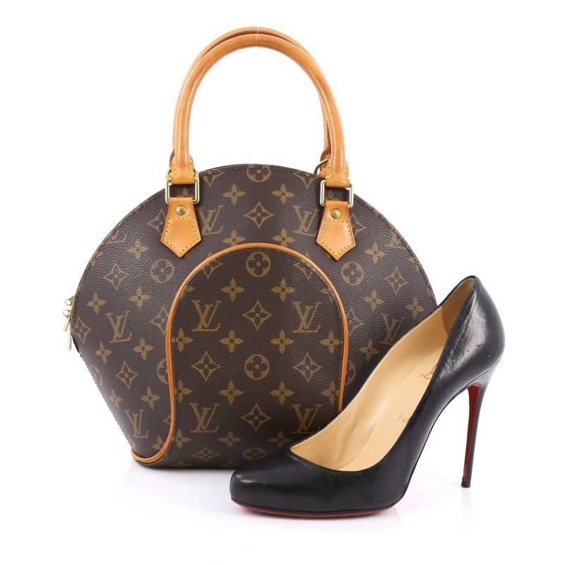 This authentic Louis Vuitton Ellipse Bag Monogram Canvas PM is uniquely structured with the brand's iconic monogram canvas print and bowler-shape. This bag features natural monogram cowhide leather pipings, dual rolled handles and gold-tone hardware