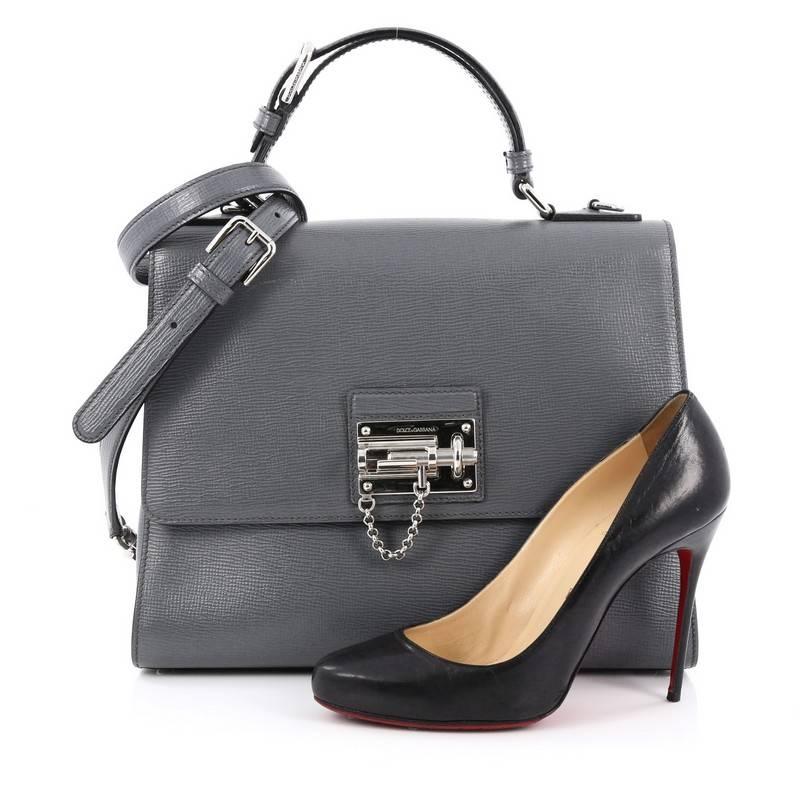 This authentic Dolce & Gabbana Monica Handbag Leather Large is a chic and luxurious bag perfect for stylish fashionista. Crafted from grey leather, this handbag features leather top handle, detachable and adjustable shoulder strap, foldover top with