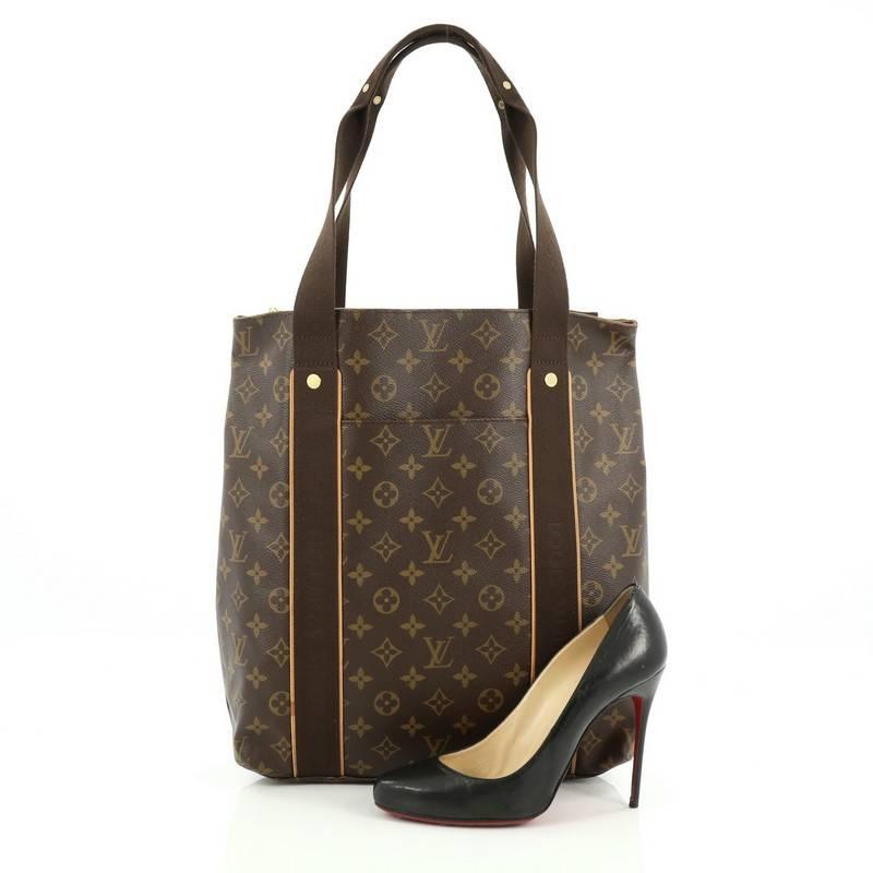 This authentic Louis Vuitton Cabas Beaubourg Monogram Canvas showcase a classic tote design perfect for everyday use. Crafted from the brand's iconic brown monogram coated canvas, this tote features dual flat canvas handles with Louis Vuitton name