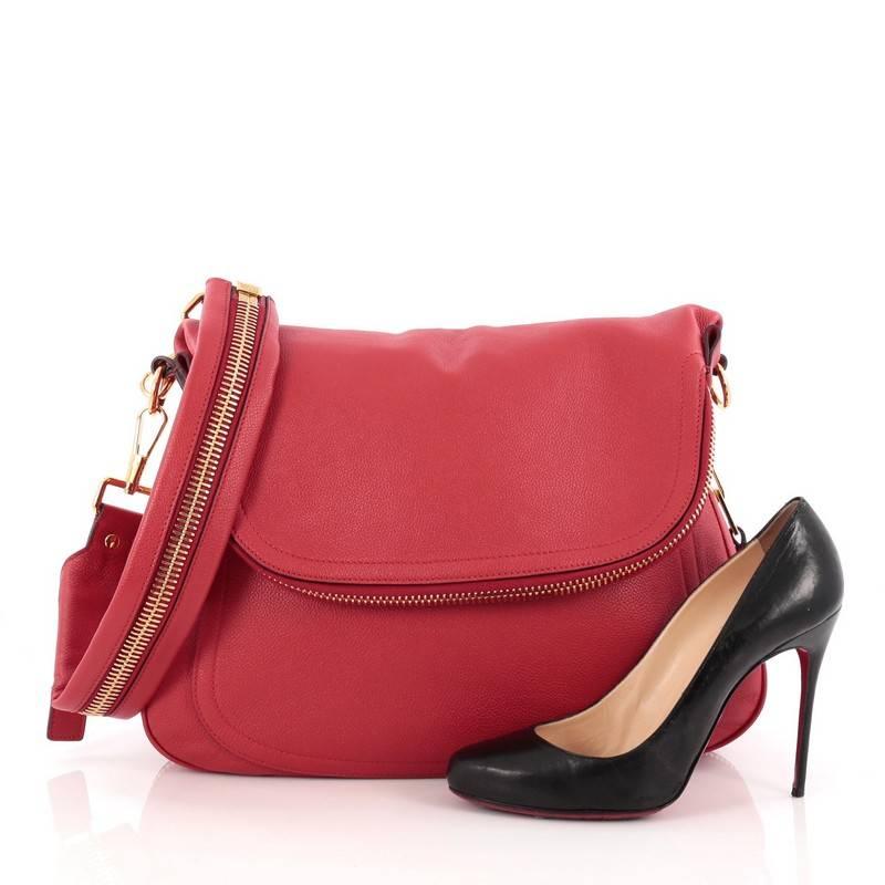 This authentic Tom Ford Jennifer Shoulder Bag Leather Large redefines modern luxury with timeless elegance. Crafted in red leather, this signature saddle shoulder bag features a single leather strap with zip details, front zip pocket and gold-tone