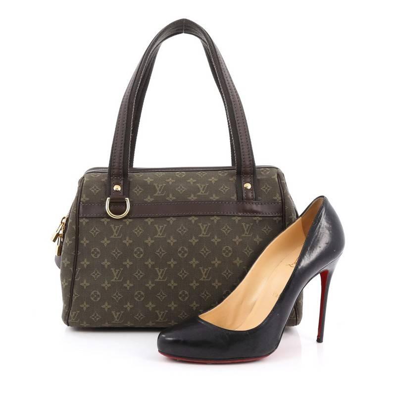 This authentic Louis Vuitton Josephine Handbag Mini Lin PM is sure to add a refreshing, casual look to any ensemble. Crafted in signature olive green monogram mini lin canvas with leather trims, this lightweight petite tote features a structured