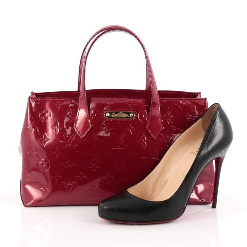 This authentic Louis Vuitton Wilshire Handbag Monogram Vernis PM combines elegance and sophistication ideal for day to day excursions. Crafted in red monogram vernis leather, this simple shopper tote features dual-flat handles, a sturdy base and