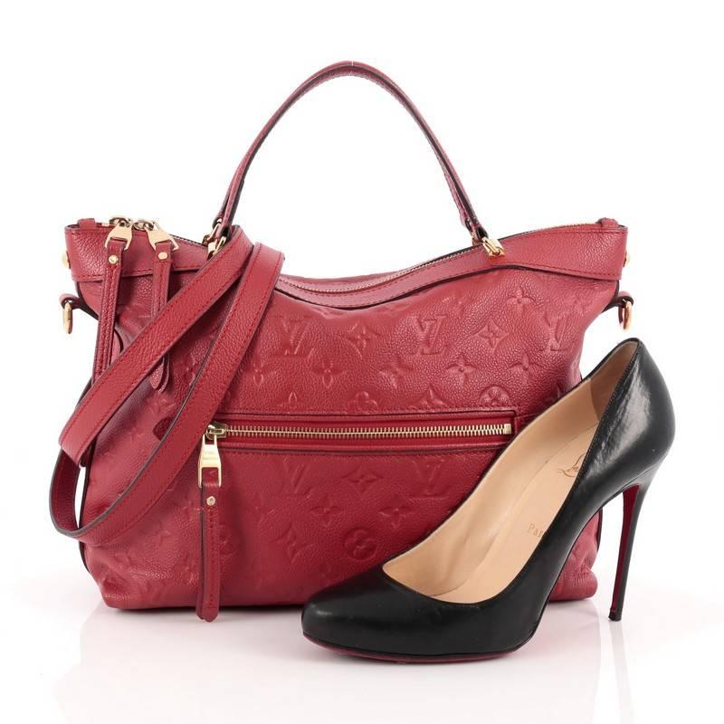 This authentic Louis Vuitton Bastille Bag Monogram Empreinte Leather PM is luxurious and sophisticated perfect for everyday use. Crafted in red monogram empreinte leather, this elegant city tote features dual-leather handles, exterior zip pocket,