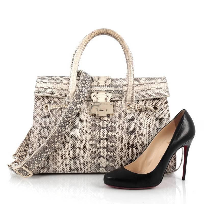 This authentic Jimmy Choo Rosalie Convertible Satchel Snakeskin Medium is a luxurious, chic, and eye-catching accessory made for everyday use. Crafted from genuine black/cream/brown snakeskin, this satchel features dual-rolled handles, frontal flap,