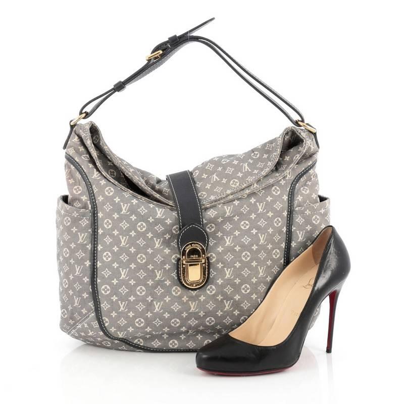 This authentic Louis Vuitton Romance Handbag Monogram Idylle is a statement piece you can surely take from day to night. Crafted with Louis Vuitton’s signature blue monogram idylle, this bag features side slip pockets, an adjustable shoulder strap,
