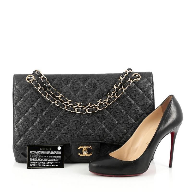 This authentic Chanel Classic Single Flap Bag Quilted Caviar Maxi is a timeless essential for any modern woman. Crafted in black quilted caviar leather, this classic flap features woven-in leather chain strap, exterior back pocket, CC signature