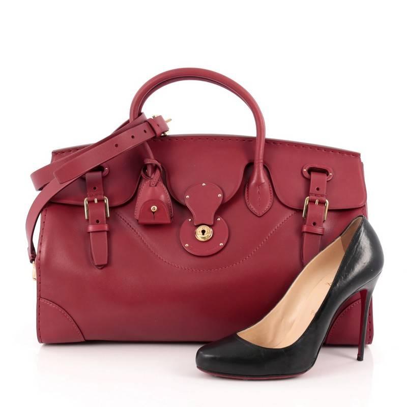 This authentic Ralph Lauren Collection Soft Ricky Handbag Leather 40 is one of the brand's most beloved styles. Crafted from red leather, this understated, elegant bag features a boxy silhouette, a folded top with a slide-lock clasp and belted