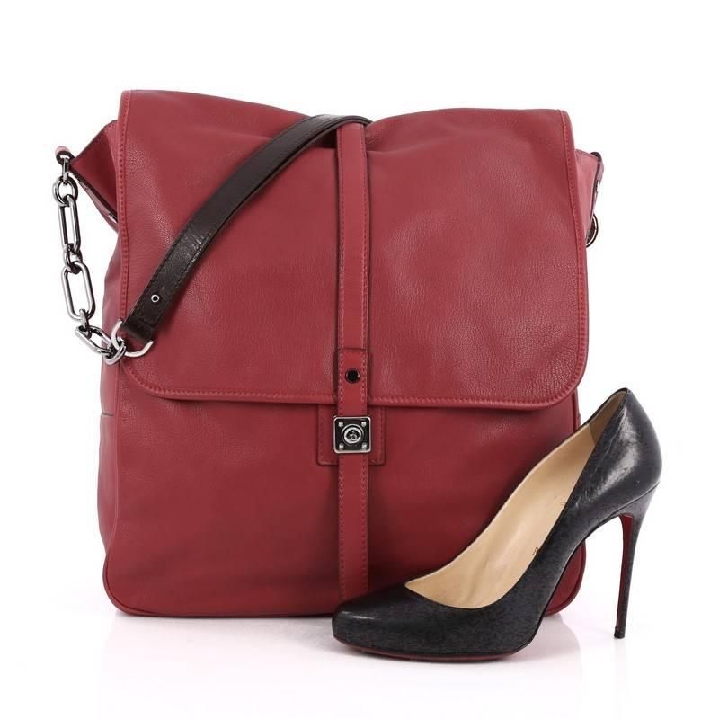 This authentic Lanvin Flap Hobo Leather Medium is feminine in design ideal for everyday use. Crafted from red leather, this chic hobo features polished chain straps with leather shoulder pads, front flap with press-lock closure and gunmetal-tone