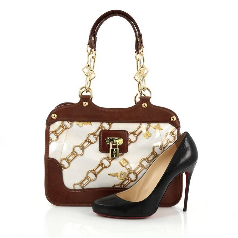 This authentic Louis Vuitton Charms Cabas PVC Over Monogram Silk is a limited edition bag designed by Marc Jacobs for the spring/summer 2006 collection, only available for VIP customers. Crafted from Monogram Charm print on silk protected by crystal