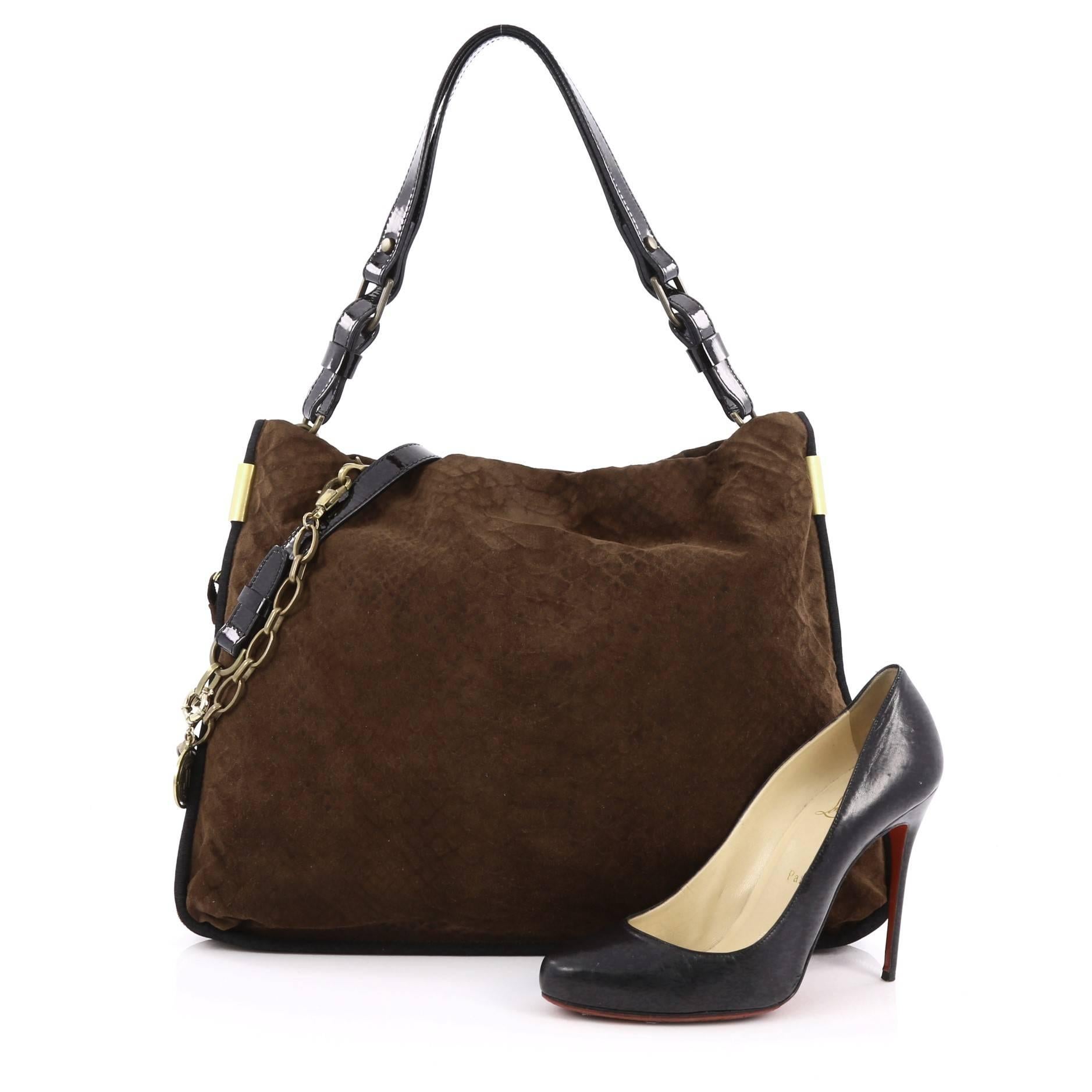 This authentic Lanvin Amalia Bucket Bag Python Embossed Suede Large is classic and feminine in design ideal for everyday use. Crafted from brown python embossed suede, this slouchy, oversized bag features polished chain straps with leather pad,