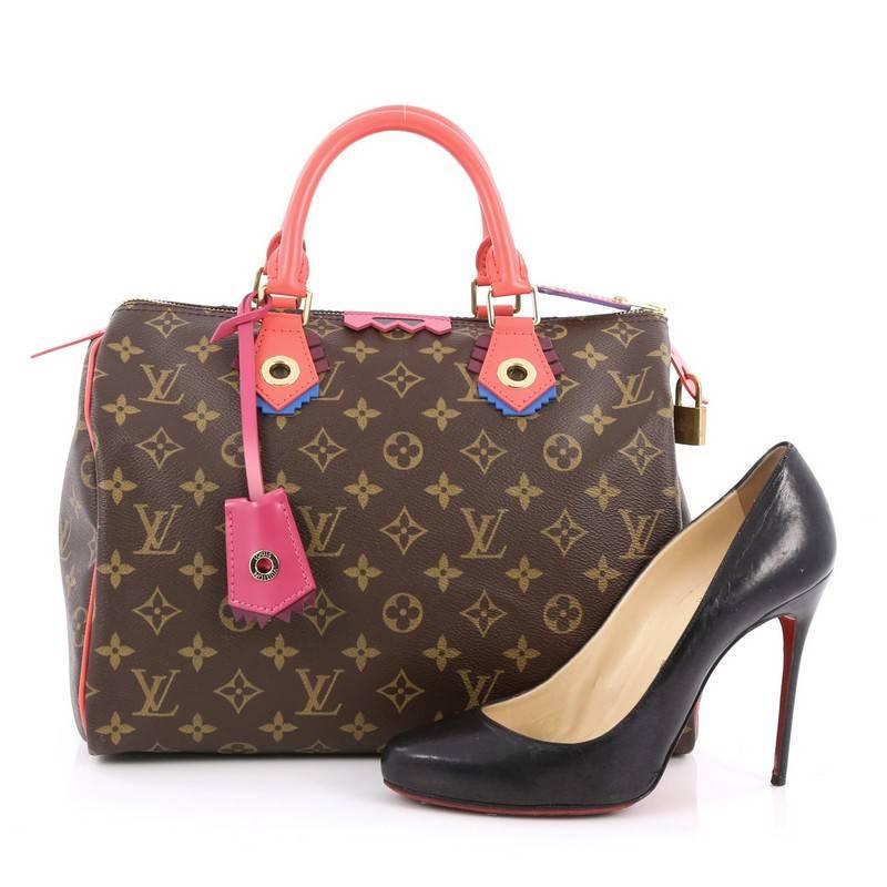 This authentic Louis Vuitton Speedy Handbag Limited Edition Totem Monogram Canvas 30 presented in the brand's Fall/Winter 2015 Collection updates its classic Speedy with playful styling and inspired by Gaston Vuitton's african tribal masks. Crafted