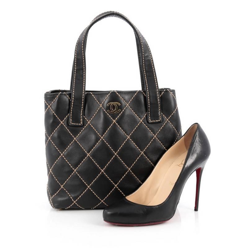 This authentic Chanel Surpique Tote Quilted Leather Small is a chic and luxurious bag perfect for your everyday looks. Crafted in black leather, this tote features Chanel's distinct diamond quilted design with standout contrast stitching accented