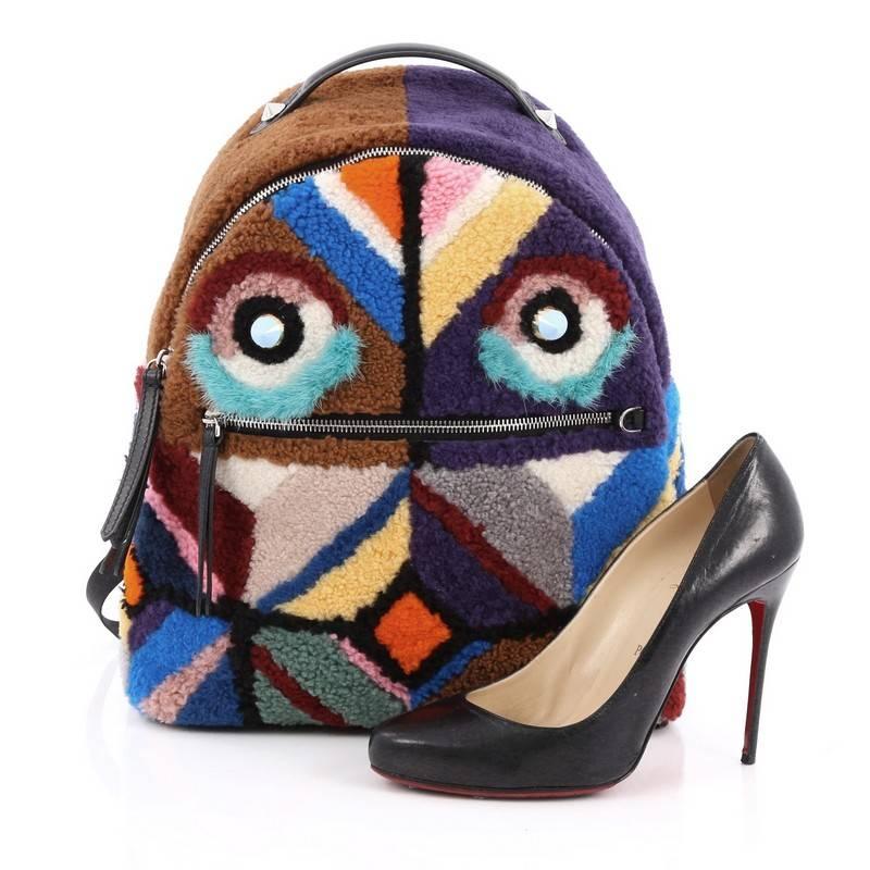 This authentic Fendi Bugs Backpack Multicolor Shearling with Fur is an eye catching, luxurious, playful style made for on-the-go fashionistas. Crafted from genuine multicolored dyed mink fur and dyed lamb shearling fur, this unique bag features,