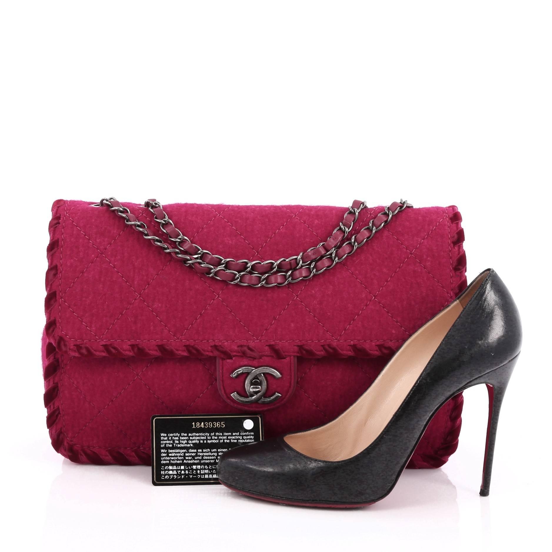 CHANEL WHIPSTITCH FLAP BAG QUILTED FELT JUMBO DESCRIPTION 
This authentic Chanel Whipstitch Flap Bag Quilted Felt Jumbo from the brand's Spring 2015 Collection is a modern, romantic essential made for any modern woman. Crafted in magenta felt, this