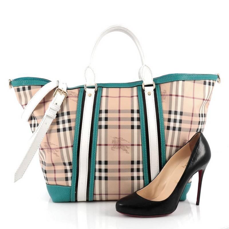 This authentic Burberry Jameson Tote Haymarket Coated Canvas and Leather Medium is an effortlessly styled tote that will elevate any look. Crafted from check print coated canvas with turquoise and white leather trims, this chic bag features
