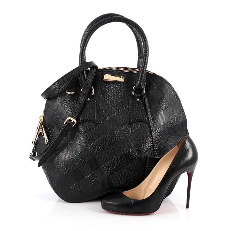 This authentic Burberry Orchard Bag Embossed Check Leather Medium has an elegant and simplistic design with a compact silhouette that is ideal for everyday use. Crafted from black embossed check leather, this vintage-inspired bag features